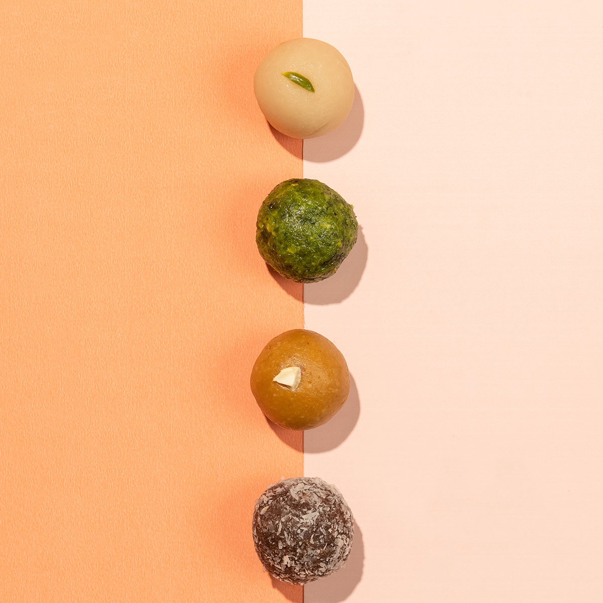 Mishtaa Assorted Nutty Bliss Box, a premium selection of healthy ladoos made with nuts and natural ingredients.